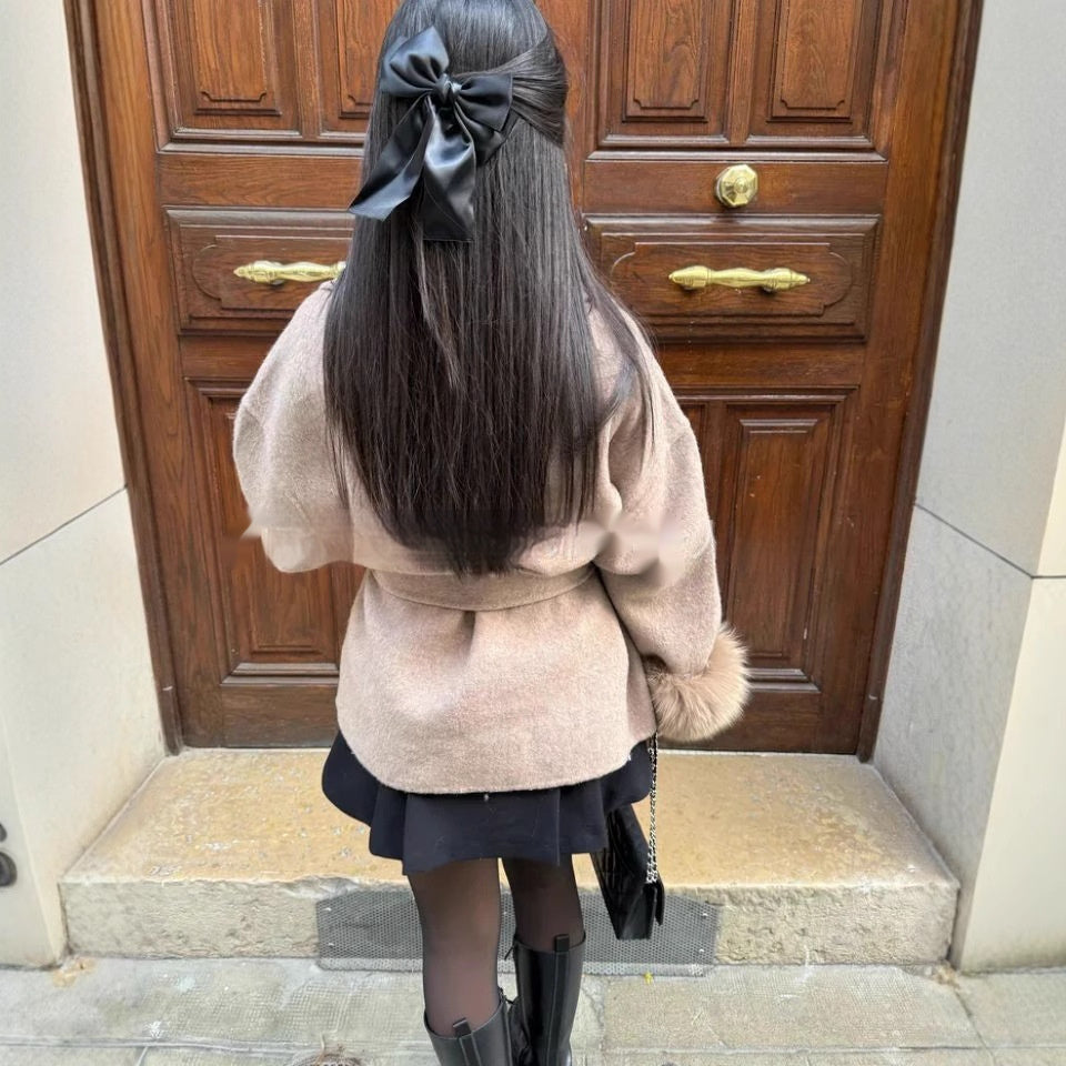 Manteau long avec manches en fourrure